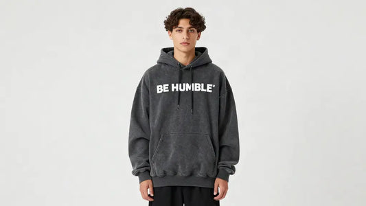 Model wearing an oversized charcoal Be Humble hoodie